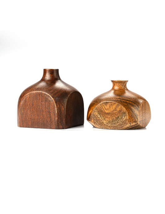 A small, round, brown wooden vase with a smooth finish and visible wood grain, displayed against a white background.
