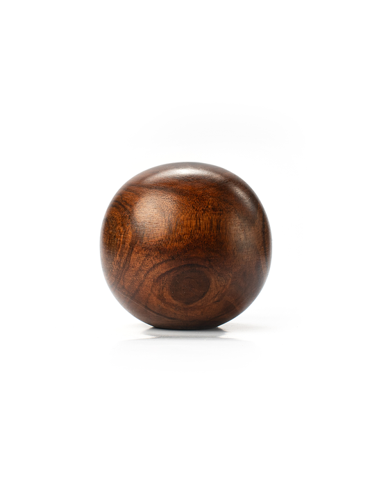 A round wooden paperweight with a rich brown color and visible wood grain patterns.