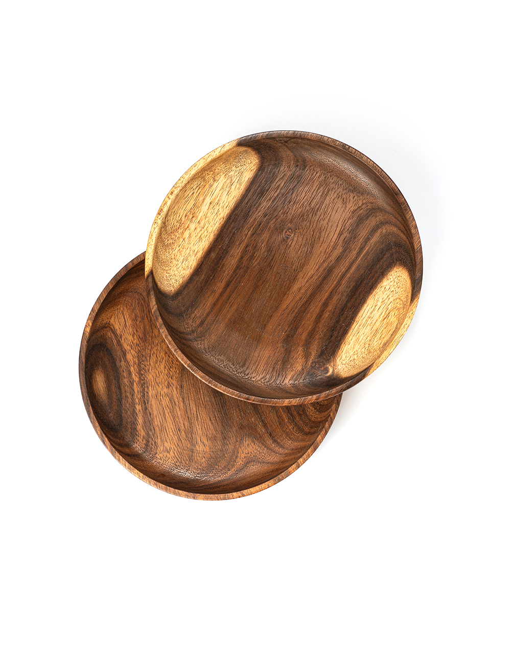A set of two wooden plates, with varying shades of brown, placed one inside the other.