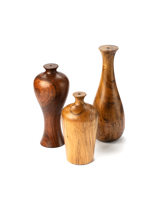 Three wooden vases of varying sizes with a smooth finish and distinctive wood grain, arranged vertically.
