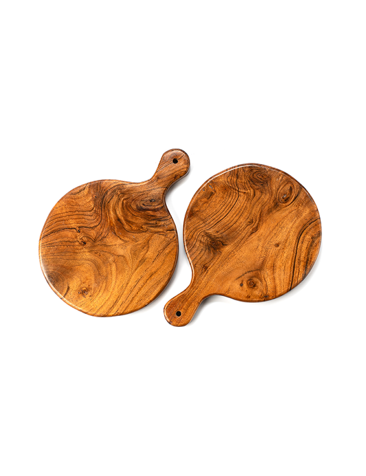 A round, brown wooden cutting board with a handle, displayed against a white background.