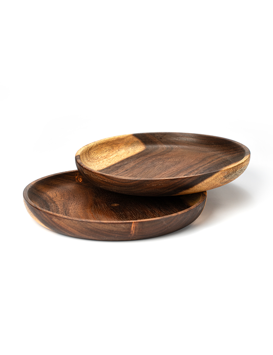 A set of two wooden plates, with varying shades of brown, placed one inside the other.