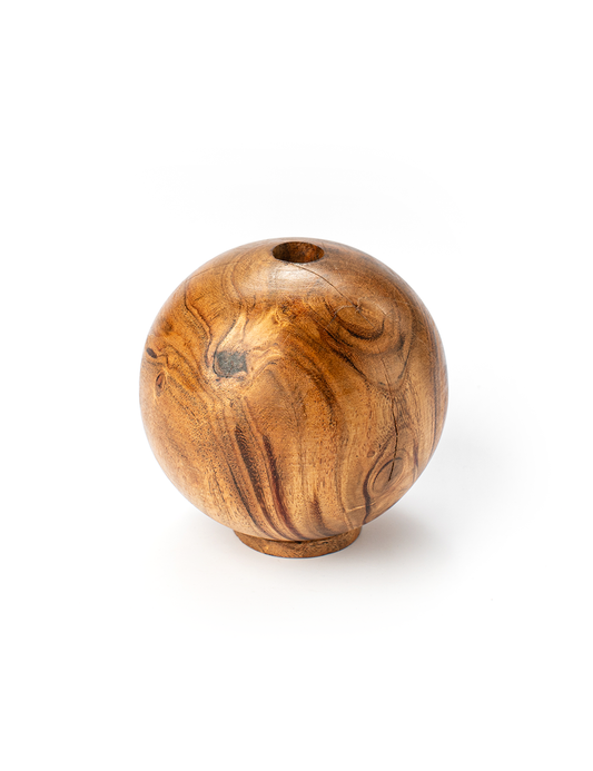 A round wooden paperweight with a visible natural wood grain on a white background.