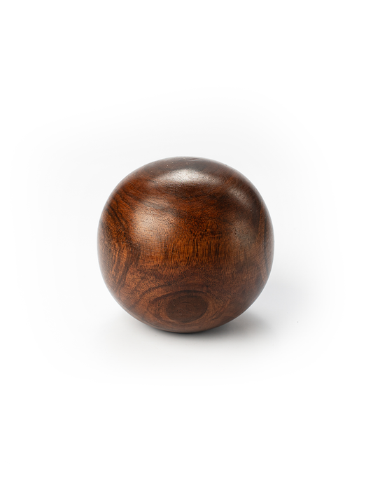 A round wooden paperweight with a rich brown color and visible wood grain patterns.