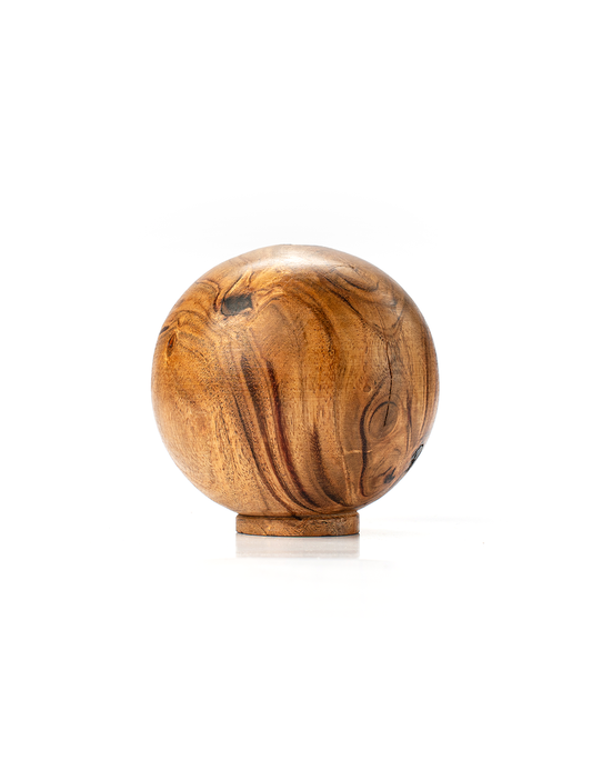 A round wooden paperweight with a visible natural wood grain on a white background.